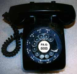 The 1940's desk phone dial shows its phone number: PA 6-5000.