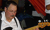 Tim plays electric bass