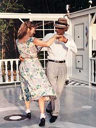 Betty and Larry dance in the open air.