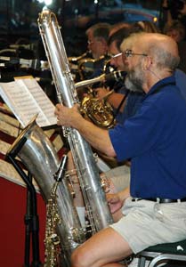 The side view shows the soprano in front of the bass sax.