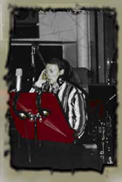 Kirk Lindberg in Studio M - black and white with hand-tinted red music stand