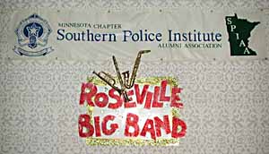 The Roseville Big Band sign hangs below the Minnesota Chapter, Southern Police Institute Alumni Association sign.