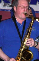 Glen plays his tenor sax with his eyes closed.
