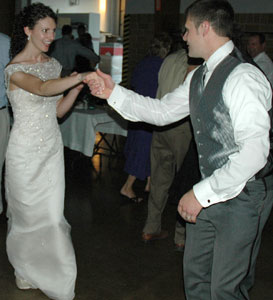 Sara smiles as she twirls back to Andy