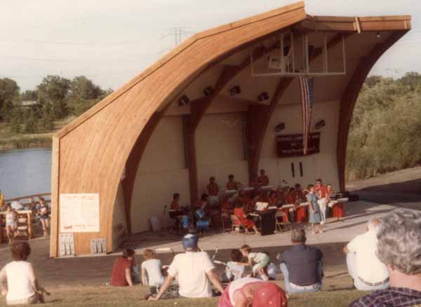 The band shell opens toward the terraced slope to the south. The large doors in the center of the shell are shut.