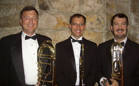 Bob, Doug, and Glen pose with their trombones.