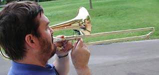 Glen Newton plays an alto trombone in a Roseville Big Band concert in Roseville's Central Park.