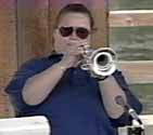 Linda playing trumpet with sunglasses
