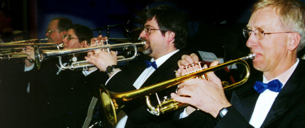The trumpet section plays a unison passage.