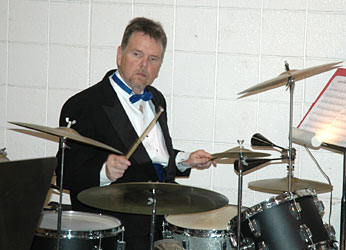 Ed Finley plays drum set.