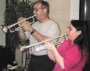 Peter Davis and Kim Kermes play trumpets.