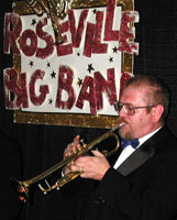Gene plays in front of the "Roseville Big Band" sign.