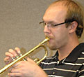 Neil plays trumpet