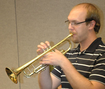 Neil plays trumpet.
