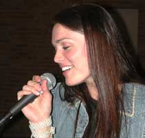 Lauren sings into the mic