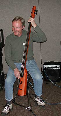 Steve plays his fretless, body-less bass.